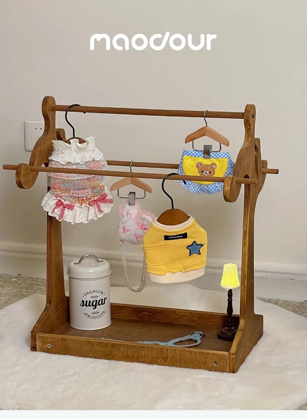 Compact pet clothes organizer with wooden storage base